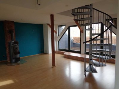 Außergewöhnliche 3-Zimmer-Wohnung mit Dachterrasse und Kaminofen