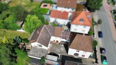 Zwei Häuser – ein Zuhause: Großzügiges Anwesen mit Gartenidylle auf 870 m² Grundstück