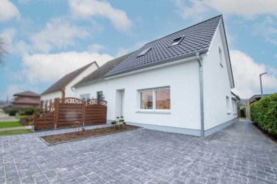 Erstbezug nach Sanierung! Moderne Doppelhaushälfte in idyllischer Lage am Kanal in Augustfehn/Apen z