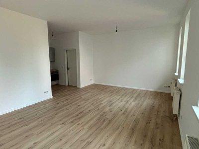 Lichtdurchflutete 1-Zimmer-Wohnung im Erdgeschoss mit Einbauküche - ERSTBEZUG
