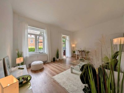 Großzügige Erdgeschosswohnung mit Balkon, Garten, Stellplatz & Garage.