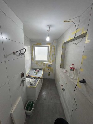 Erstbezug nach Kernsanierung: Moderne 3-Zimmer-Wohnung mit eigenem Garten und Stellplatz