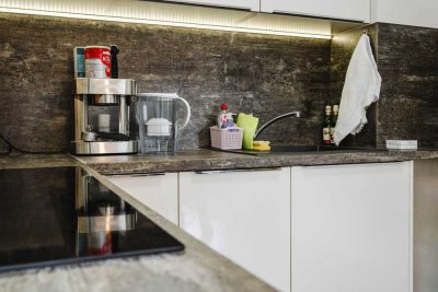Stilvoll wohnen: Moderne 2-Zimmer-Wohnung mit Terrasse, TG-Stellplatz & grüner Bauweise