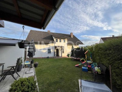 Exklusive Dachwohnung mit Gartenanteil und Blockhaus in Toplage