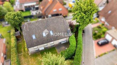 Familienfreundliches Zweifamilienhaus mit Garten und stabilen Mieteinnahmen