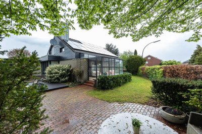 Außergewöhnliches Architektenhaus mit Sauna, Kamin und vermieteter Einliegerwohnung