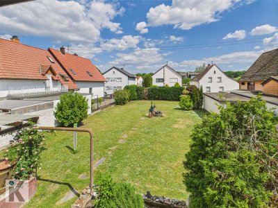 Familienidyll mit Perspektive – Haus mit Einliegerwohnung und Baugrundstück