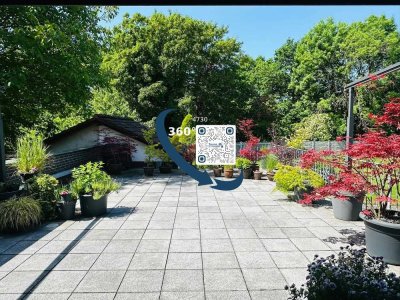 Erdgeschoss-Eigentumswohnung mit großer Terrasse, Garten, EBK, Garagen und Stellplätzen