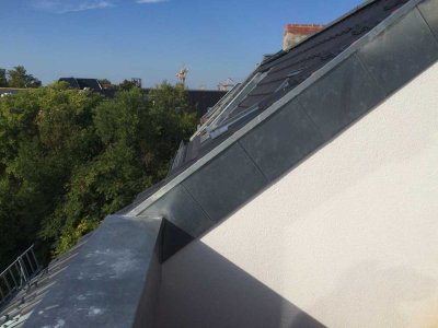 Moderne Dachgeschosswohnung mit Terrasse in historischem Gebäude nach aufwendiger Kernsanierung