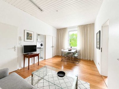 Attraktive Zwei-Zimmer-Wohnung mit Terrasse und Garten zur Mitnutzung
