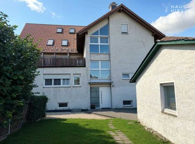 Großzügiges Mehrfamilienhaus mit Garten, Garagen & Gewerbebereich, ausgebauter Dachboden