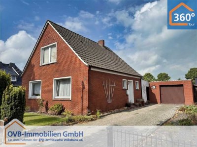 Einfamilienhaus mit Garage und großzügigem Grundstück