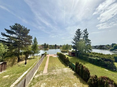 NEUWERTIGES Haus am Pöttschinger See - BJ 2022 - ca. 574m² Pachtgrund - ca. 198m² NFL - 4 Zimmer - 2 Bäder - Balkon und Terrasse - neuwertige Einbauküche - große Doppelgarage - Direkter Seezugang