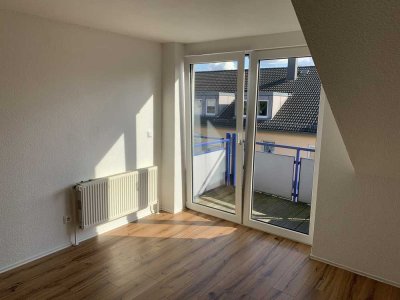 Zentrale, sonnige 2 Zimmer DG Wohnung mit Balkon und Stellplatz