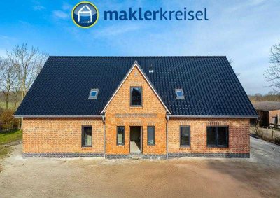 Kurz vor Fertigstellung! Ebenerdige Neubauwohnung mit Sonnenterrasse und Carport