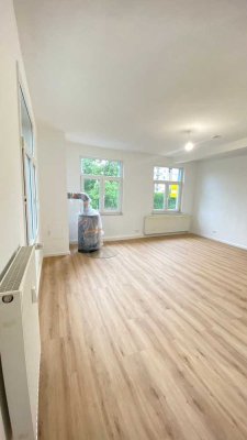 Modernisierte und helle 2-Zimmer Wohnung mit Kaminofen
