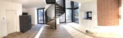 Exklusives Wohnen im historischen ERBA-Turm - Galeriewohnung im EG mit Terrasse und Garten