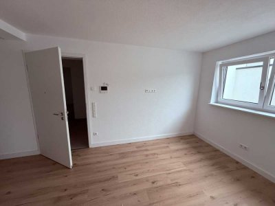 ERSTBEZUG: Stilvolle 1-Zimmer-Wohnung mit Einbauküche & Stellplatz im Neubau *Pendler aufgepasst*