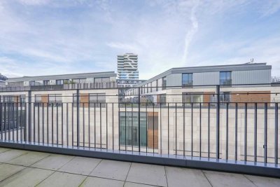 Stilvolle Erdgeschosswohnung mit großer Terrasse, moderner Küche und Tiefgaragenstellplatz