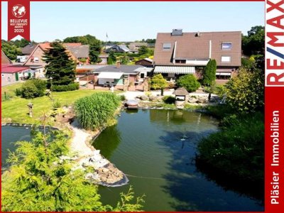 Mehrfamilienhaus * 4 Wohneinheiten * traumhafter Garten * Teichanlagen * 1 Wohneinheit vermietet *