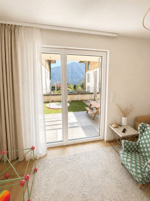 PROVISIONFREI - Moderne Gartenwohnung mit 100 m² Eigengarten und Tiefgaragenstellplatz in Maurach am Achensee