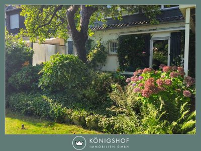 Erdgeschosswohnung mit Sonnenterrasse und traumhaften Garten für Singles und Senioren!