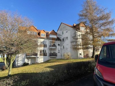 Attraktive Investitionsmöglichkeit: Vermietete 2-Zimmer-Wohnung mit Balkon und Carport