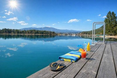 Faszinierende Seegartenresidenz mit weitläufigem Privatbadestrand am Faaker See