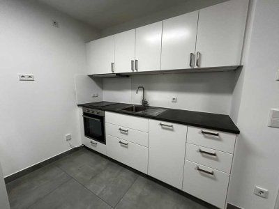 Moderne 2-Zimmer-Neubauwohnung mit Balkon, Aufzug & 2 Stellplätzen – ruhig & zentral in Stockstadt