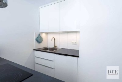 Modernisierte 1-Zimmer-Wohnung am Rotkreuzplatz – U1/U7, Südbalkon, Aufzug & TG