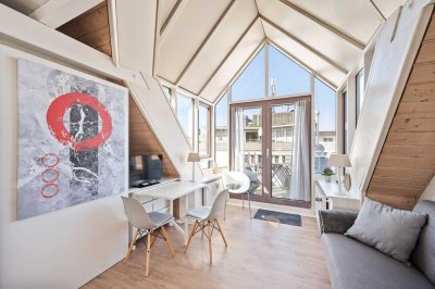 Exklusive 1,5-Zimmer-DG-Wohnung mit Empore & Tiefgaragenstellplatz in absoluter Top-Lage