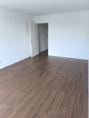 Moderne 1-Zimmer Wohnung im Ortszentrum mit Tiefgaragenplatz