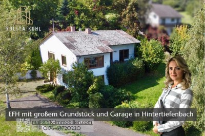 Ein Ort zum Durchatmen: Freistehendes Einfamilienhaus mit Aussicht, Garage und großem Grundstück