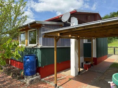 DEUTSCHMANN IMMOBILIEN ***** ivd - Kleinhaus auf idyllischem Grundstück in unmittelbarer Seenähe!