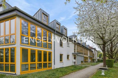 Moderne Zwei‑Zimmer‑Erdgeschosswohnung mit Süd-Balkon, Wintergarten und Tiefgarage