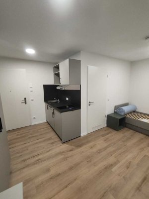 Moderne 1-Zimmer Wohnung mit Küche und Dachterrasse - voll möbliert - Erstvermietung - Neubau