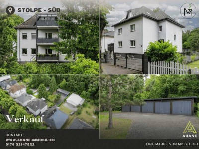 Investor oder Eigennutzer: Vielseitiges Dreiparteienhaus mit 6 Garagen in Stolpe-Süd