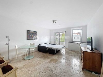 Stilvolles Einzimmerapartment mit Natursteinboden und Balkon – möbliert, mitten in Wilmersdorf