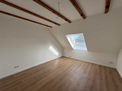 Erstbezug! DG-Wohnung mit eigenem Garten