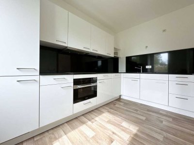 2-Zimmer-Wohnung mit moderner Einbauküche, Südwest-Balkon & Stellplatz