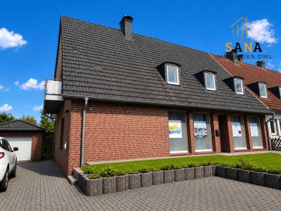 Verklinkerte Doppelhaushälfte mit Ladenlokal in Bielefeld-Senne / Windflöte