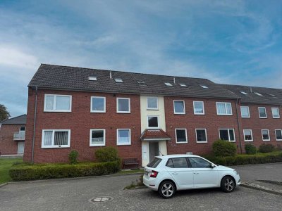 Büsum: Schicke Hochparterre-Wohnung mit Westbalkon in ruhiger Zentrumslage