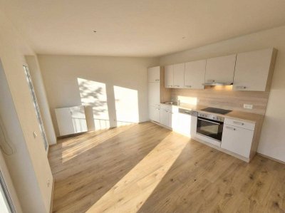Geförderte Neubauwohnung mit Terrasse im 1. Stock