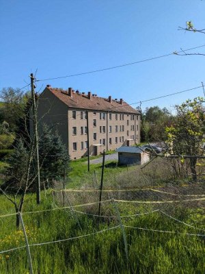Teilvermietetes Mehrfamilienhaus mit 12 Einheiten und Entwicklungspotenzial in ruhiger Lage von C...