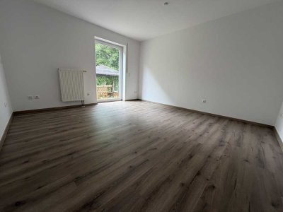 Erstbezug in Bestlage: Hochwertig sanierte Wohnung mit Garten und Stellplatz