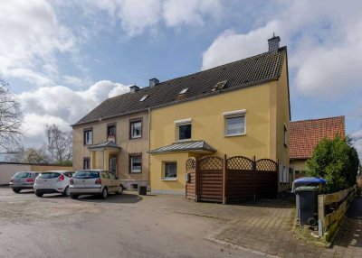 4-Familienhaus mit Lagerhalle & 19 Garagen auf ca. 1.673 m² Bauland in beliebter Wohnlage