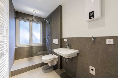 Modern & Hochwertig saniert: 1-Zimmer-Wohnung mit Südost-Balkon im Erbbaurecht