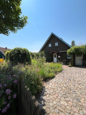 SCHMUGGEROW IMMOBILIEN - kleines Einfamilienhaus mit traumhaften Garten in Katingen