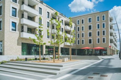 Im Herzen der Steimker Gärten mit Blick auf den Quartiersplatz – Willkommen im Promenaden Carré