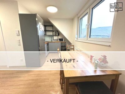 Verkauft: Charmante Maisonette-Wohnung mit Weinbergblick für nur 147.000 €.